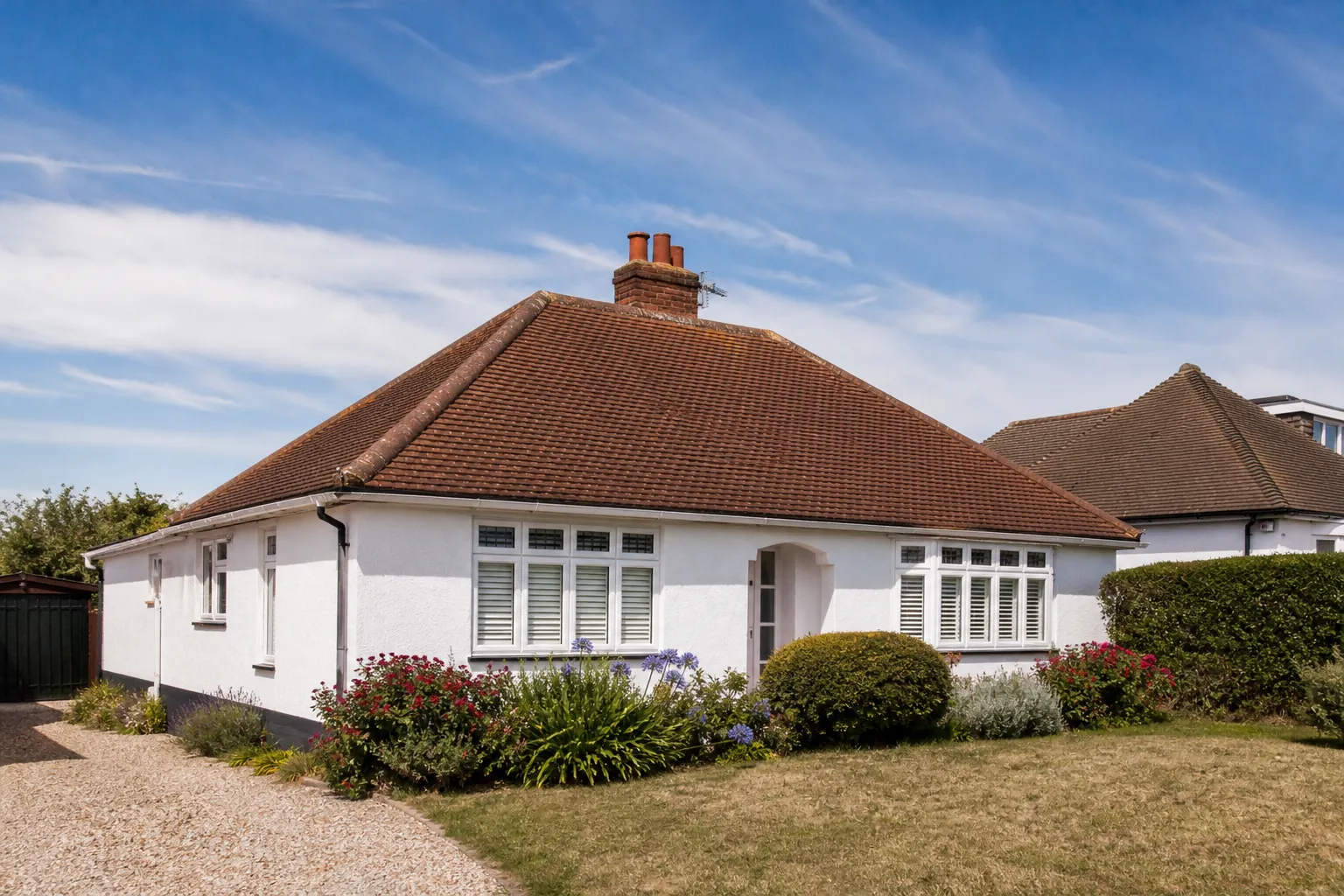 A 1930s hipped bungalow with a clay tile roof