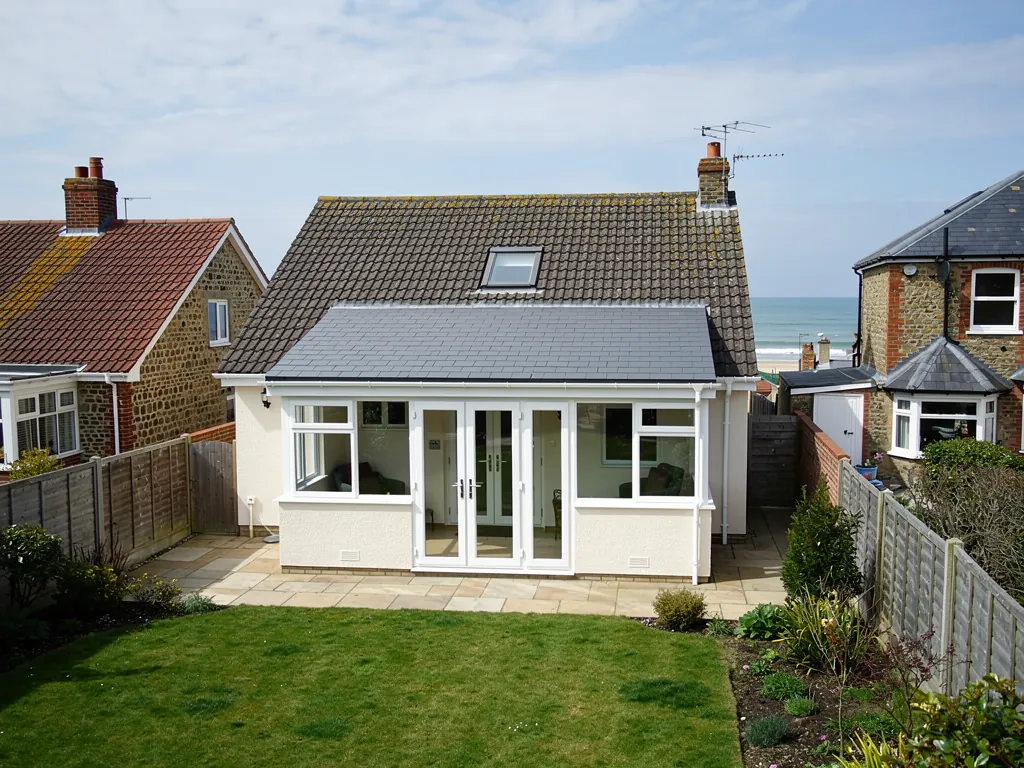 A bungalow conservatory with a new solid tiled roof