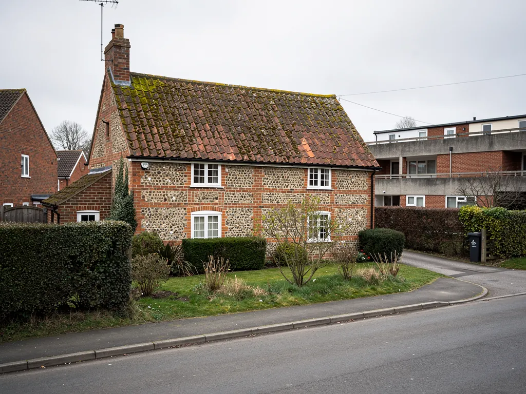 A thatched flint cottage