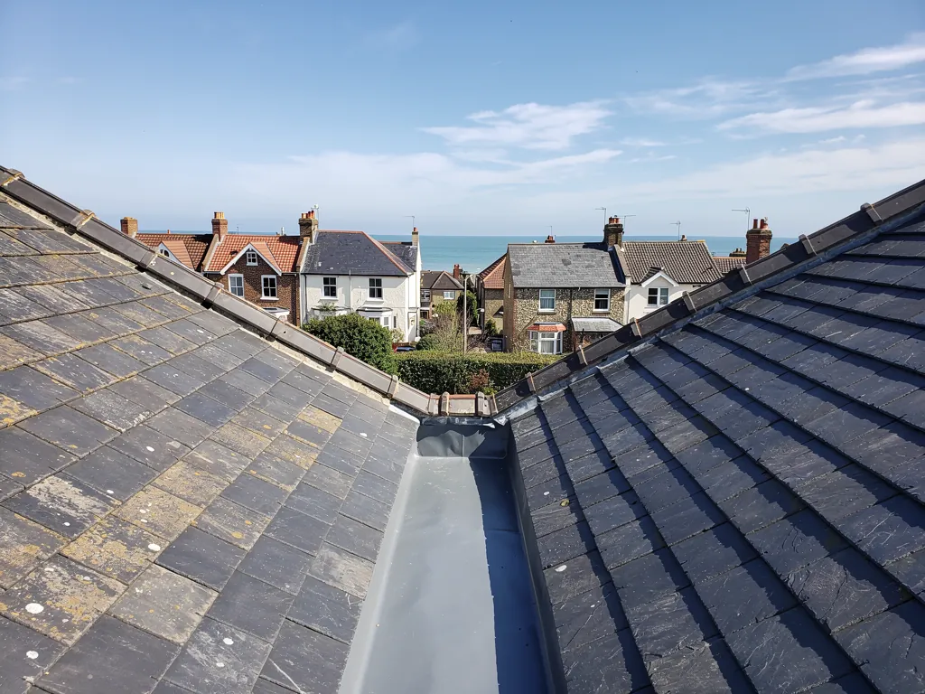 A lead valley between two slate roof slopes