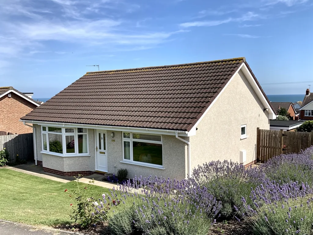 A hipped bungalow with a newly tiled roof